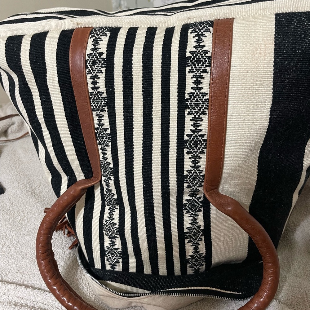 Elegant Black and White Striped Backpack with Brown Accents - Picture 8 of 9